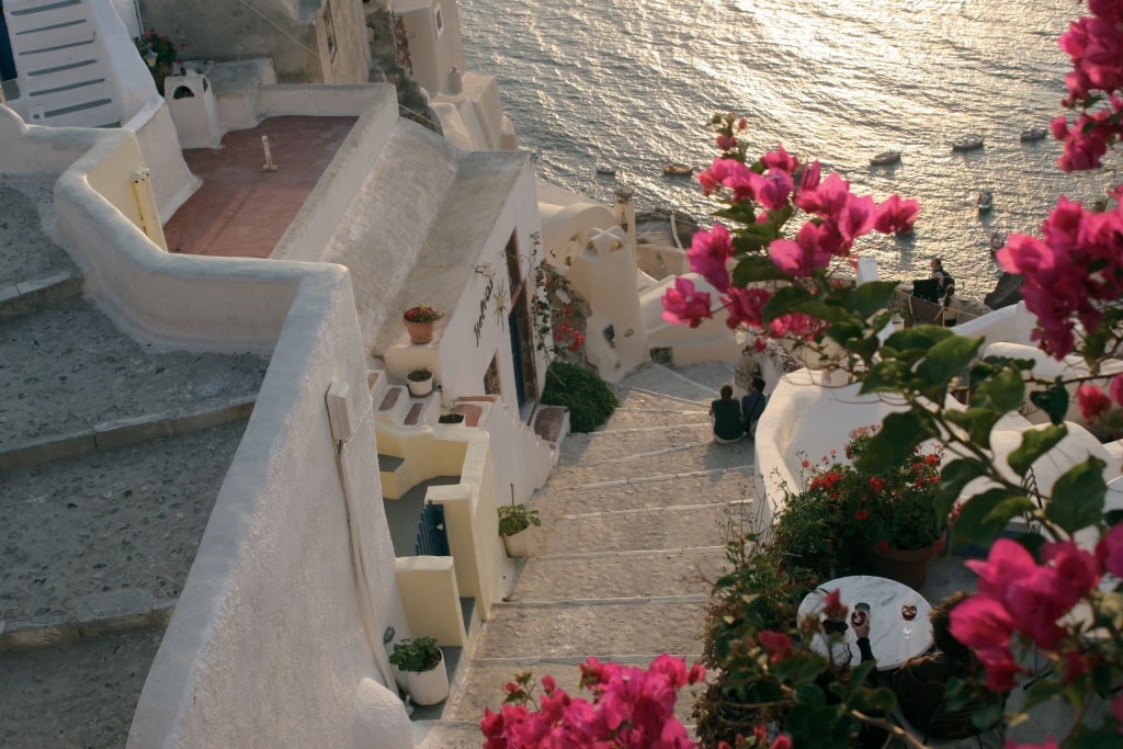 Looking down toward the Aegean Sea during a golden sunset at Santorini, Greece.
