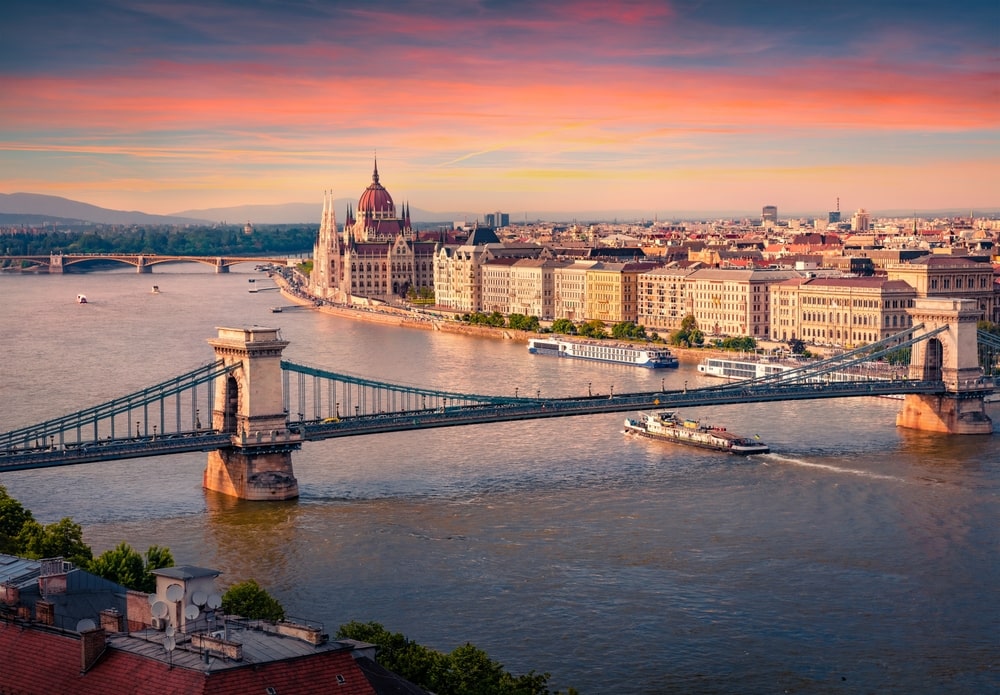 Wonderful summer cityscape of Hungarian parliament building with famous Chain Bridge on the Danube river.