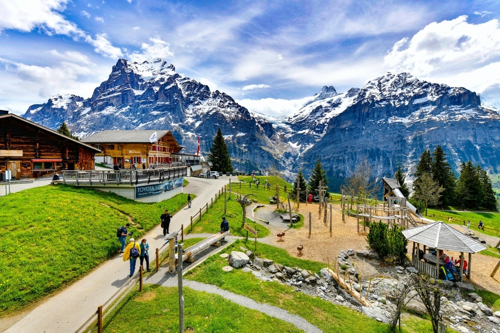 Beautiful traditional mountain playground in Grindelwald surrounded by the snowy peaks of the Alps