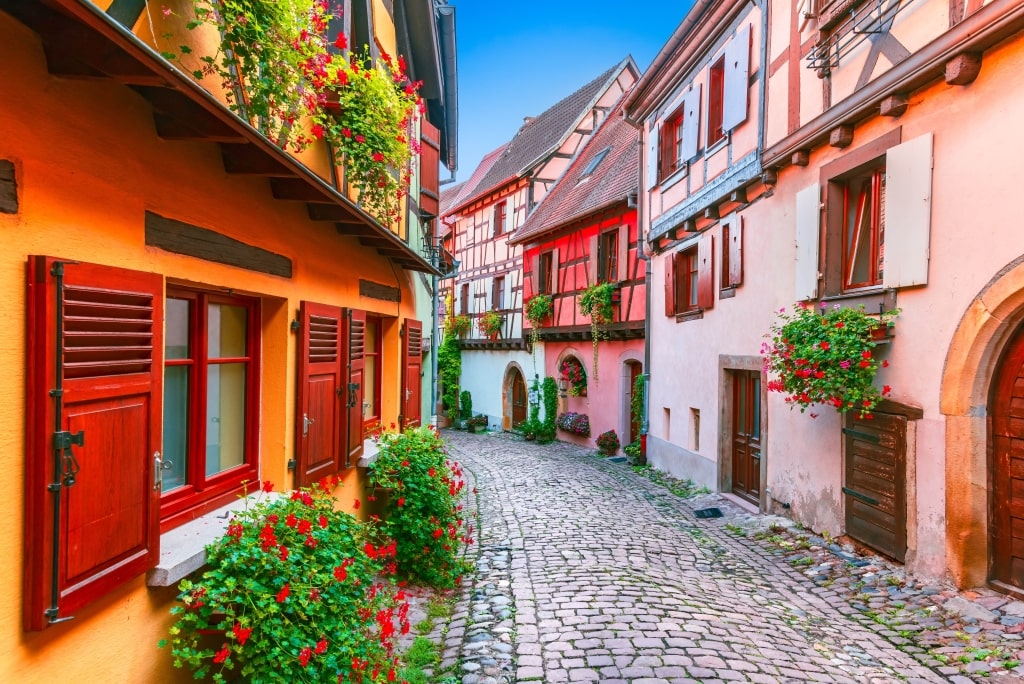 Eguisheim, France. Charming Alsace village, features colorful half-timbered houses, cobblestone streets, vineyards and medieval charm.