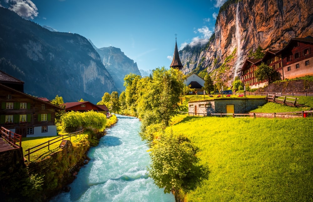 Charming alpine village in the Lauterbrunnen valley on a sunny day