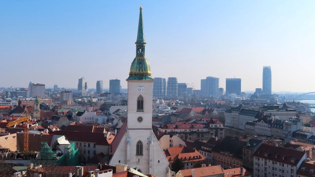 St. Martin's Cathedral stands tall over the red-roofed buildings of Bratislava, Slovakia.