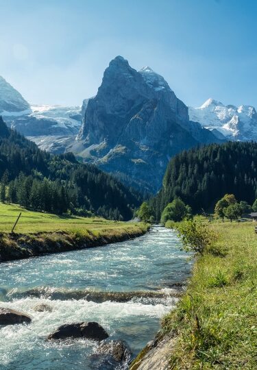 Beautiful view of Rosenlaui with wellhorn swiss alps and Reichenbach river in summer on sunny day at Bern, Switzerland