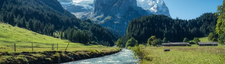 Beautiful view of Rosenlaui with wellhorn swiss alps and Reichenbach river in summer on sunny day at Bern, Switzerland