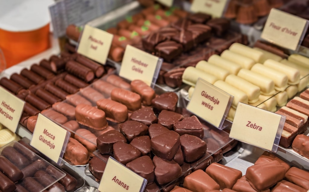 An elegant arrangement of assorted gourmet Swiss chocolate pralines and truffles.