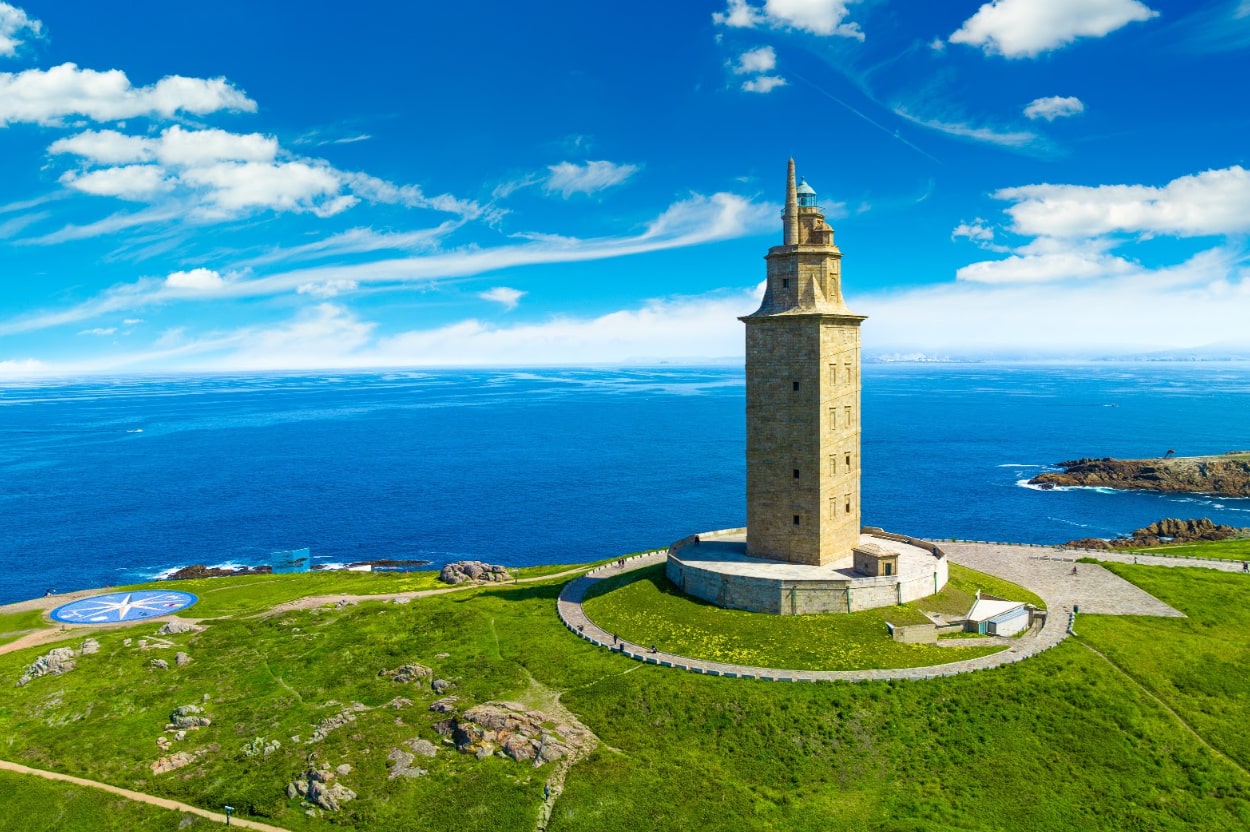 Perched upon a lush, emerald peninsula, the legendary Tower of Hercules overlooks the Atlantic’s sparkling expanse in La Coruña.