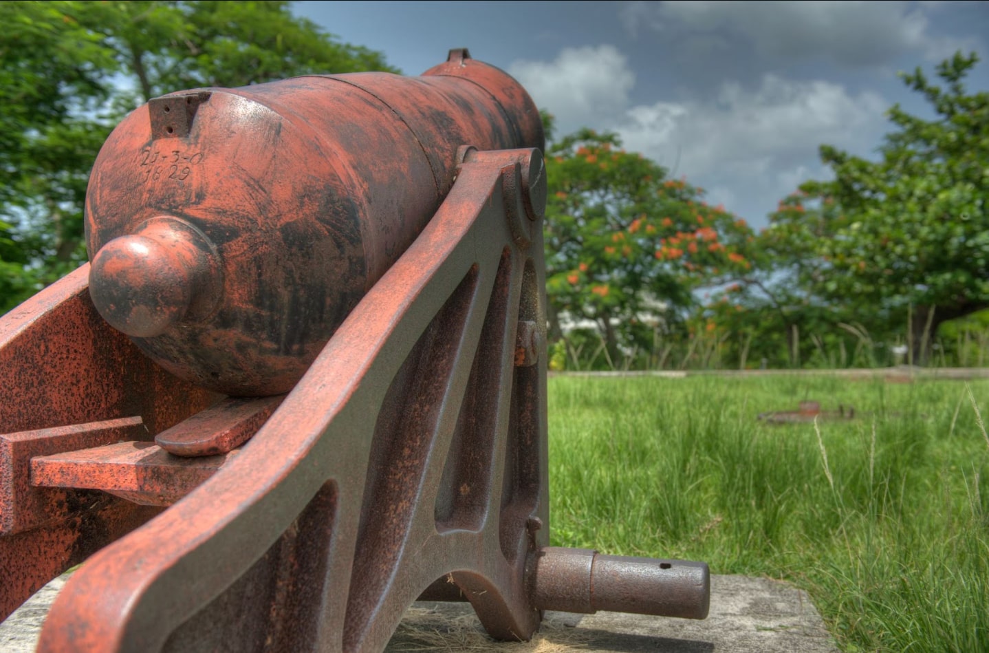An ancient cannon rests at Fort Fincastle, overlooking the harbor.