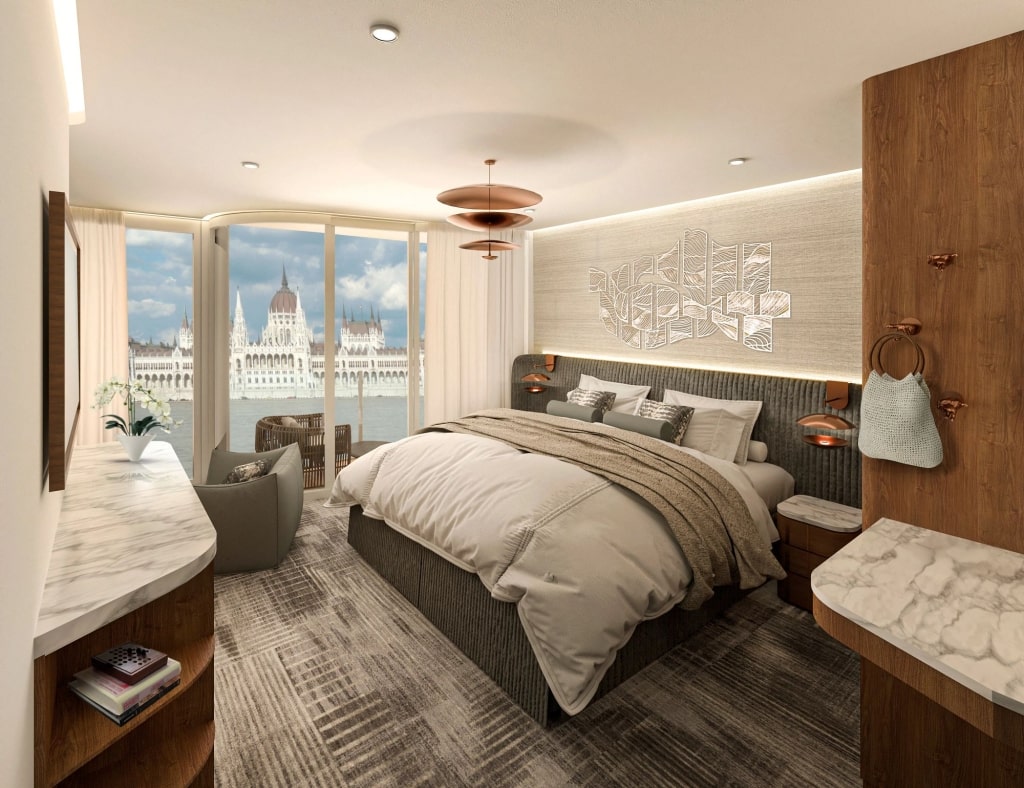 Vista Balcony staterooms: An elegant sanctuary featuring sophisticated aesthetics and secluded panoramas of the passing river.