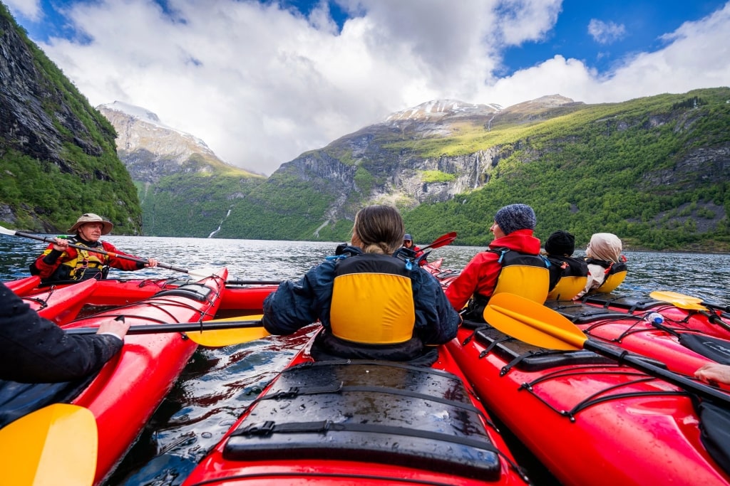 Gliding through glacial waters on a fjord kayak tour—a shore excursion that brings you face-to-face with nature’s grandest scale