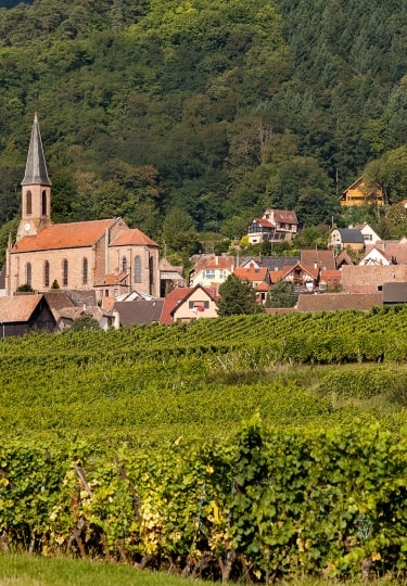 Husseren-les-Chateaux village along the famous wine route in Alsace, France
