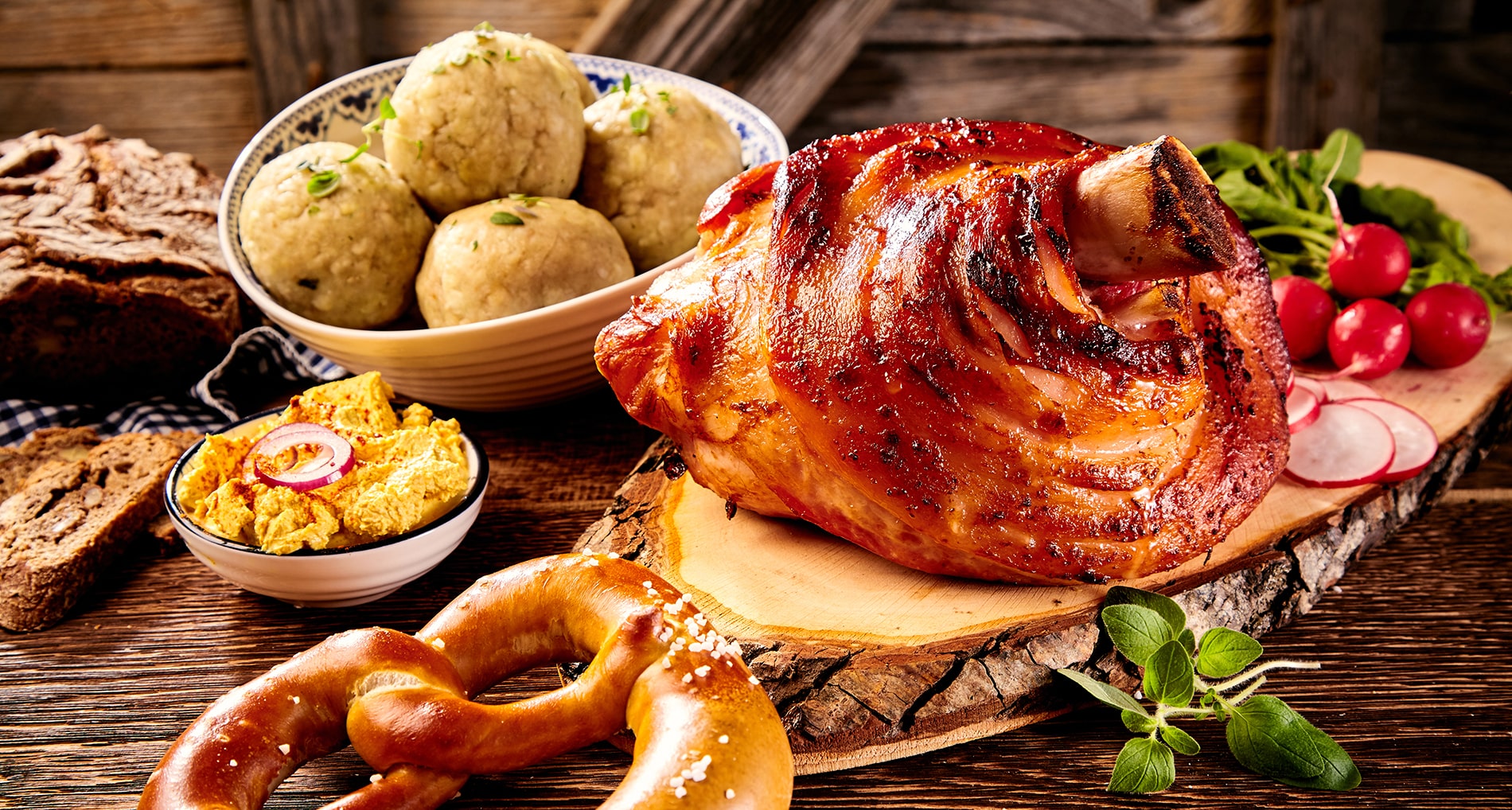 Traditional German cuisine, Schweinshaxe roasted ham hock, pretzel with obatzter cheese delicacy