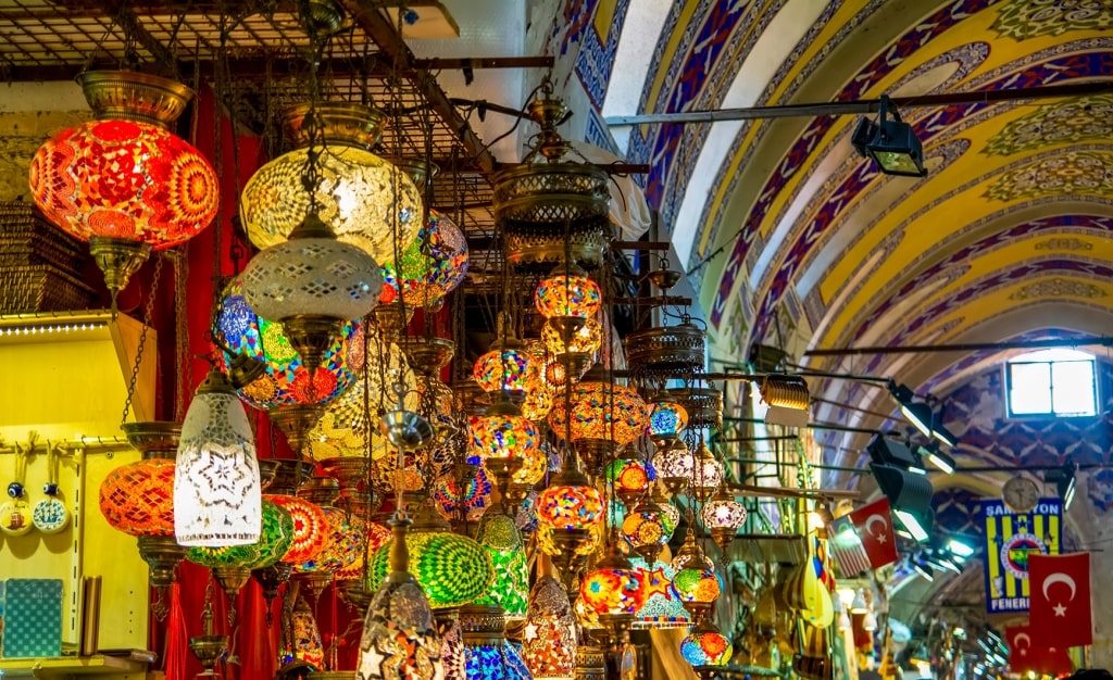 Vibrant mosaic lamps cast a warm glow inside Istanbul’s historic Grand Bazaar.