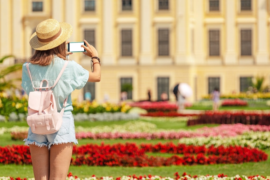 Traveler capturing a shot of the Schoenbrunn Royal Palace Garden.