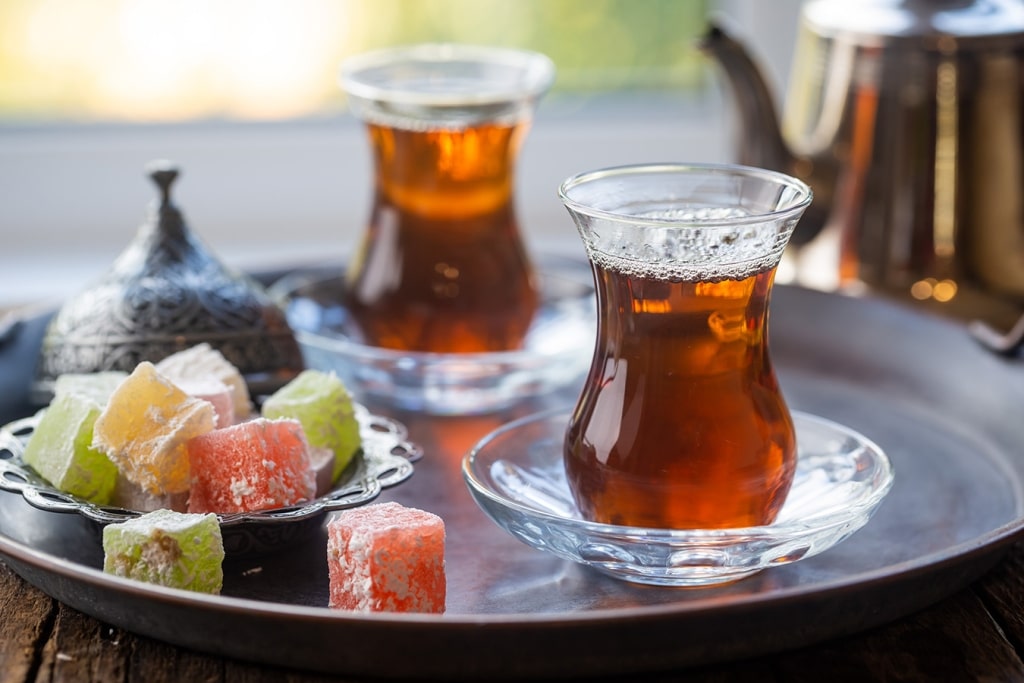 Traditional Turkish tea paired with sweet Turkish delight offers an authentic taste of hospitality.