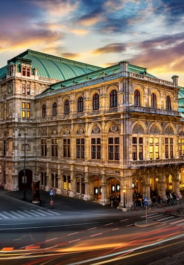 The glowing Vienna State Opera captured at twilight.