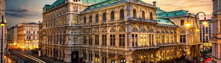 The glowing Vienna State Opera captured at twilight.