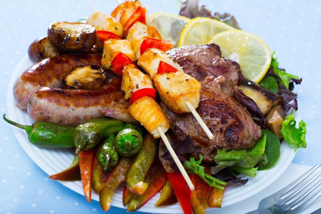 Meshana skara - dish of Bulgarian cuisine. Mixed grill consist of various types of grilled meat and sausages with vegetables