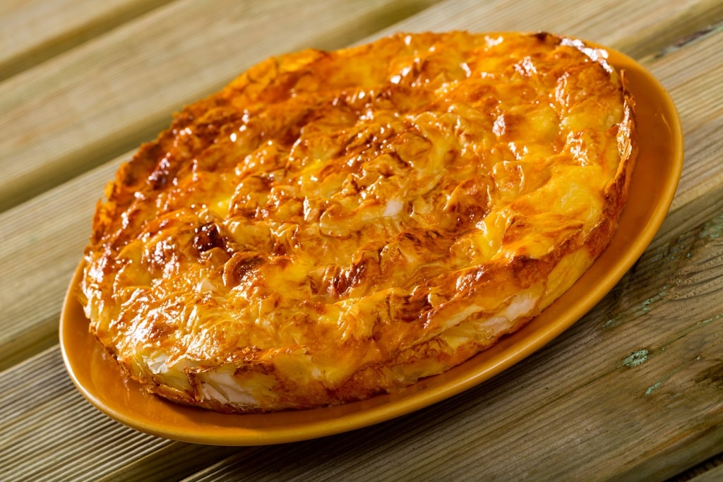 Banitsa - traditional dish from thin pastry sheets with crushed sirene or feta cheese, yogurt and eggs