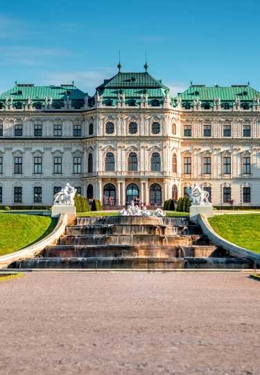 View on Upper Belvedere palace with alley and fontain cascade in Belvedere historic building complex in Vienna.