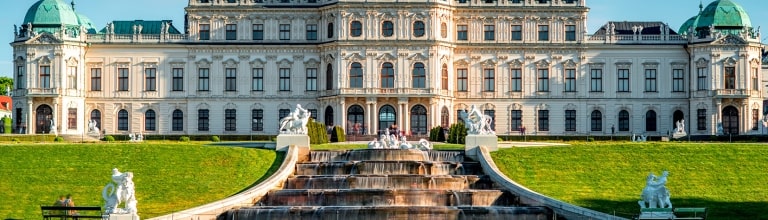 View on Upper Belvedere palace with alley and fontain cascade in Belvedere historic building complex in Vienna.