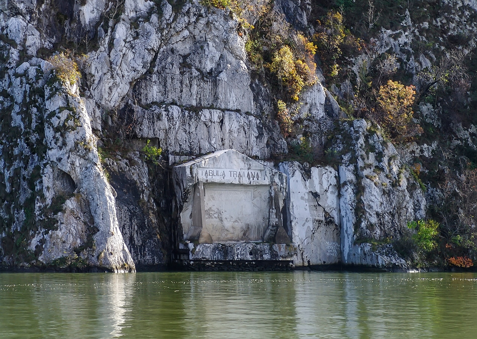 Etched into the towering Serbian cliffs, the Tabula Traiana remains an enduring Roman memorial, positioned just above the Danube’s glassy surface