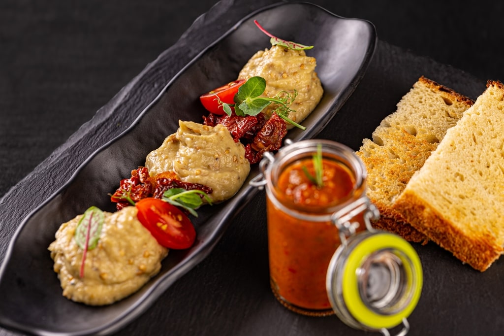 Transylvanian zacuscă spread and truffle eggplant cream served with toasted bread.