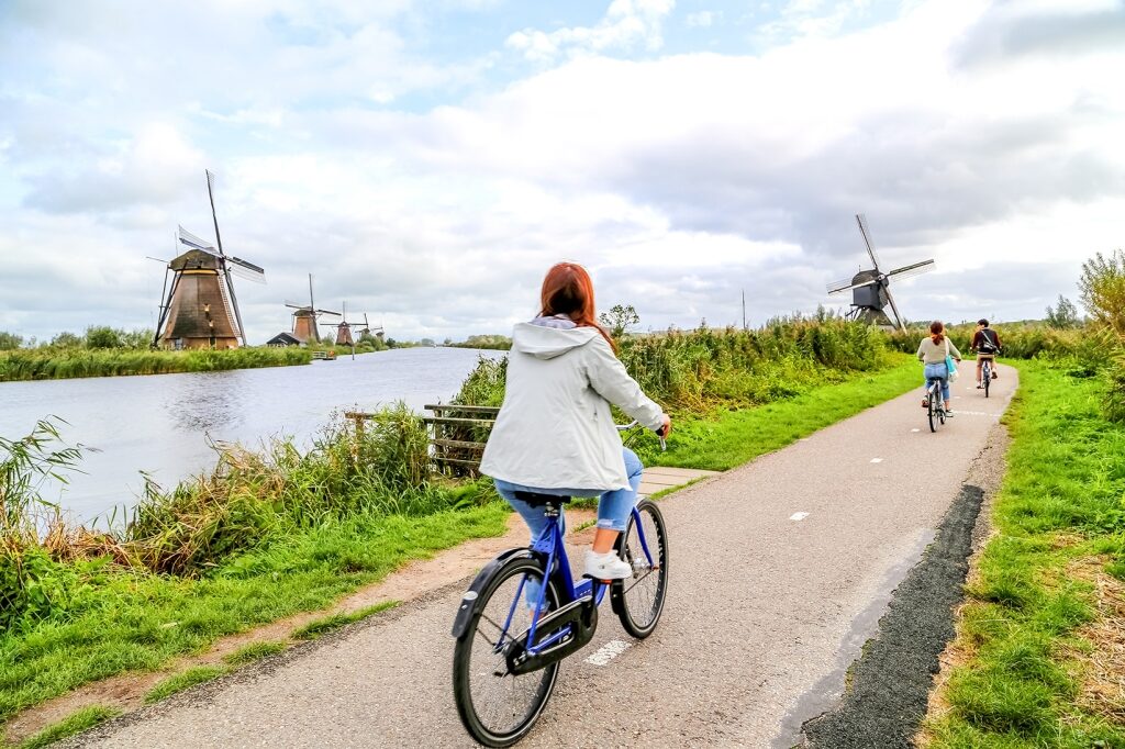 Cycling along scenic canal paths lined with historic windmills offers an active, immersive way to discover Kinderdijk on a shore excursion.