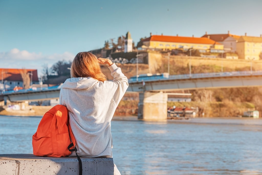 A visitor takes in the panoramic vista of Petrovaradin Fortress from across the water.