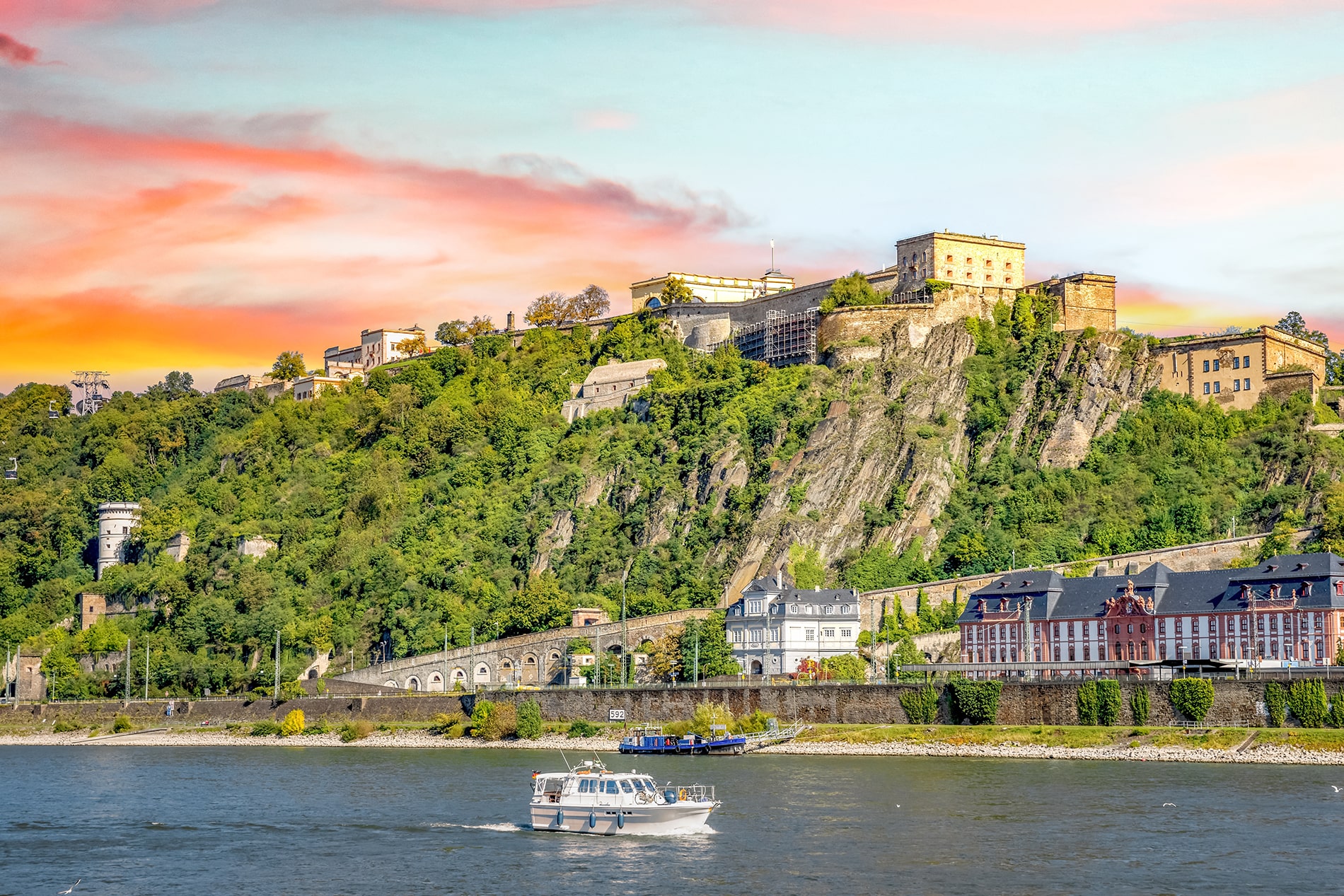 Towering high above the confluence of the Rhine and Moselle rivers, the monumental Fortress Ehrenbreitstein in Koblenz offers breathtaking panoramic views and centuries of rich Prussian history