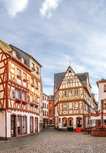 Half-timbered buildings and quiet cobblestone squares highlight the historic charm of exploring Mainz along the Rhine.