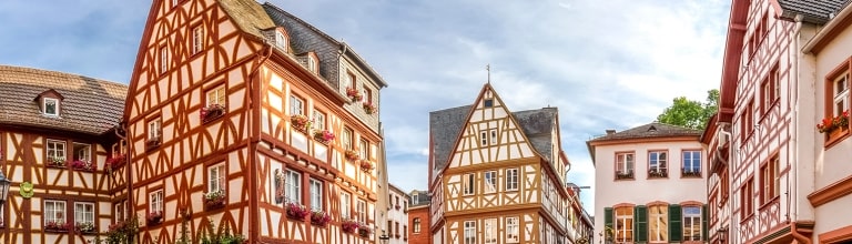Half-timbered buildings and quiet cobblestone squares highlight the historic charm of exploring Mainz along the Rhine.