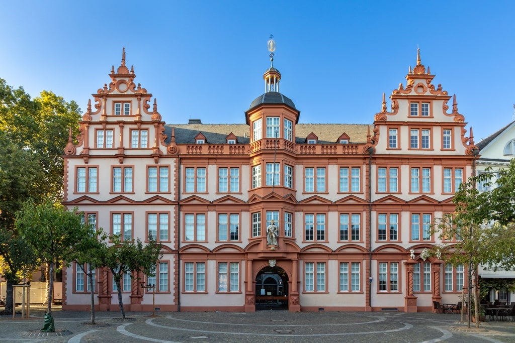The ornate Renaissance facade of the Gutenberg Museum in Mainz stands as a striking tribute to the birthplace of modern printing along the Rhine.