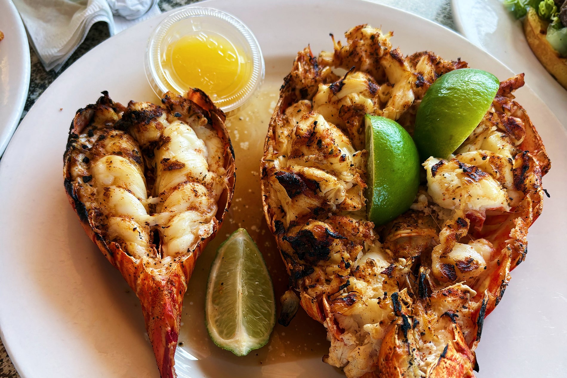 Grilled to perfection and served with fresh lime wedges, a plate of fresh Bahamian spiny lobster captures the rich, straightforward luxury of shore-side dining