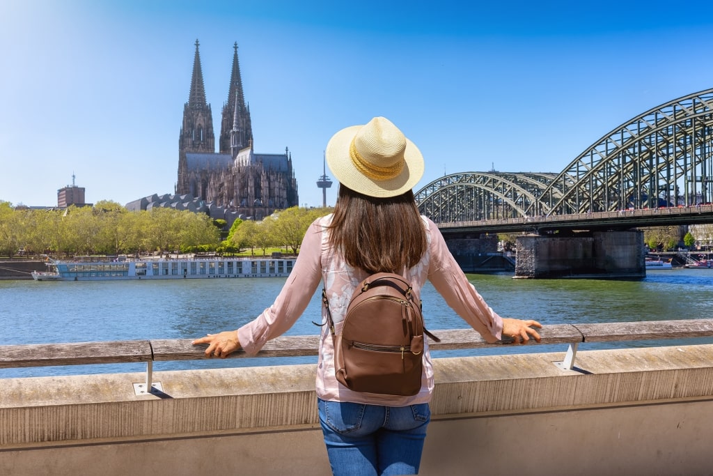 A solar traveler overlooking the Rhine toward Cologne Cathedral captures the quiet awe of arriving at Germany's most iconic riverfront landmark.