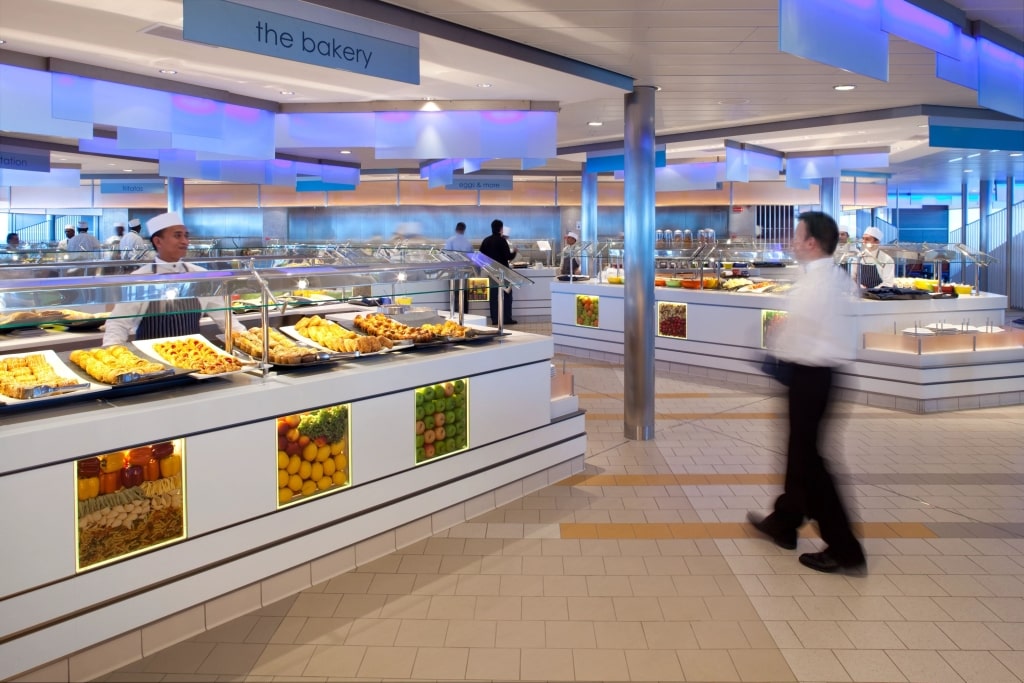 A wide selection of fresh pastries and dishes displayed at the Oceanview Café buffet onboard a Celebrity ship.