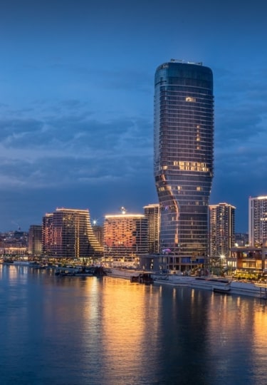 Panoramic night view of Belgrade Waterfront and the Sava River, with Belgrade Tower.