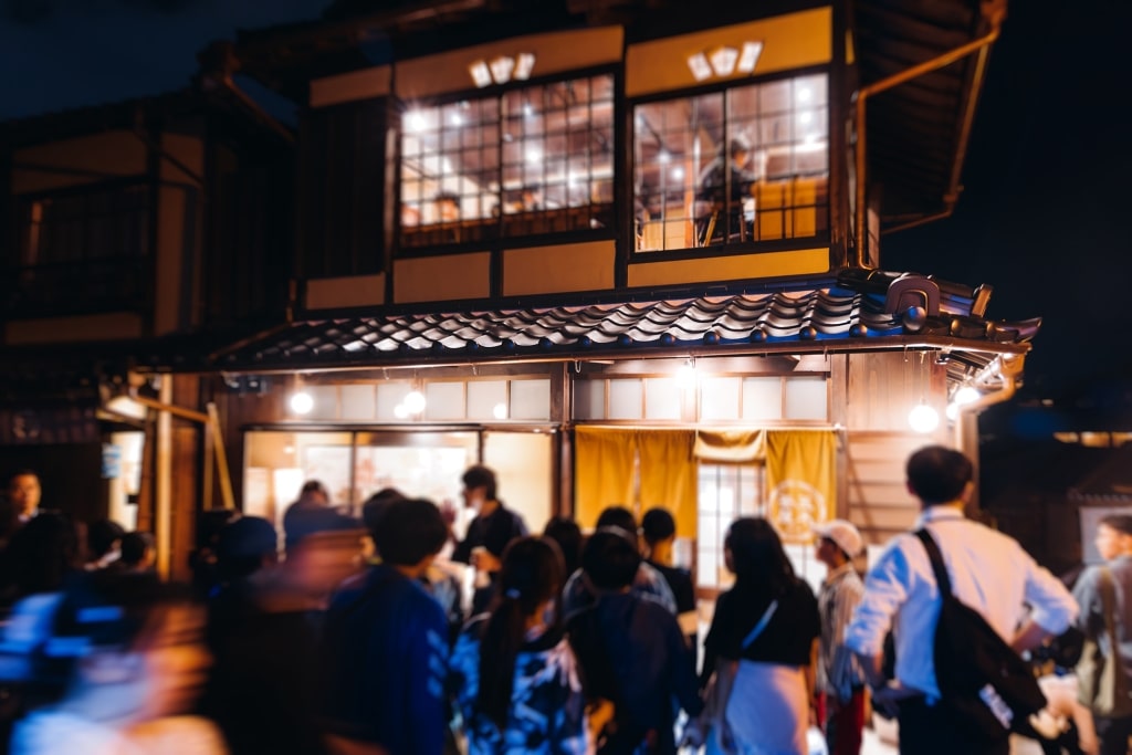 View of Gion district street, Kyoto, Higashiyama-ku, Japan, night illumination of Ninnenzaka and Sannenzaka streets, with old wooden tea houses Hokanji temple and Yasaka Pagoda, Gion geisha quarter.