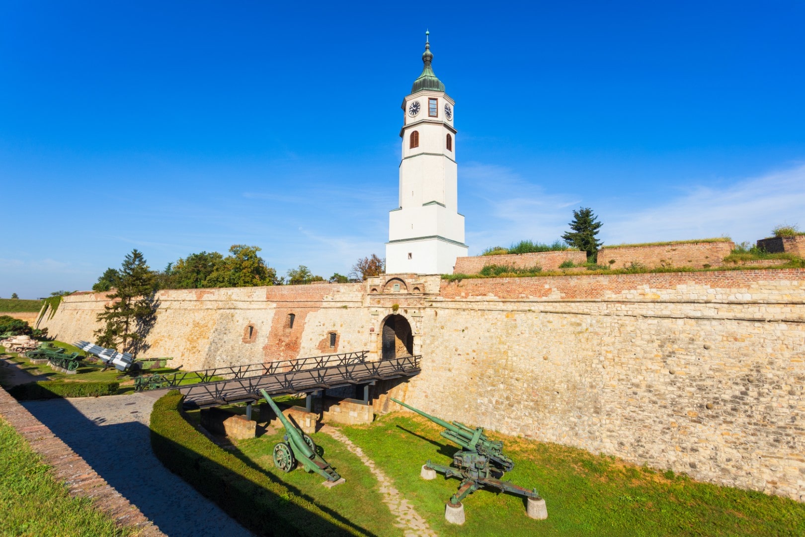 The Sahat Tower (Clock Tower) rising above the Sahat Gate and military museum display inside the historic Belgrade Fortress.