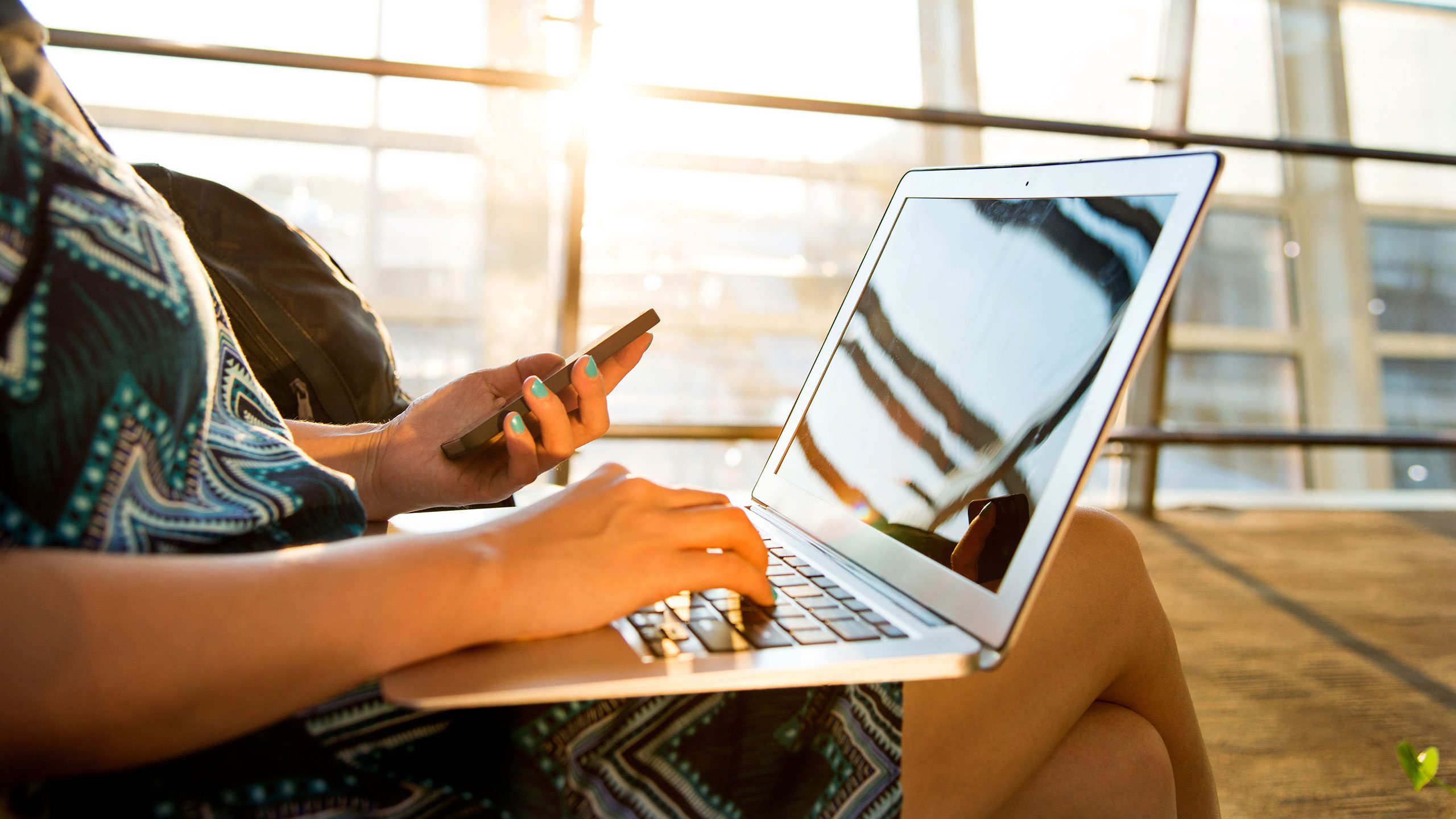 Person planning travel on a laptop