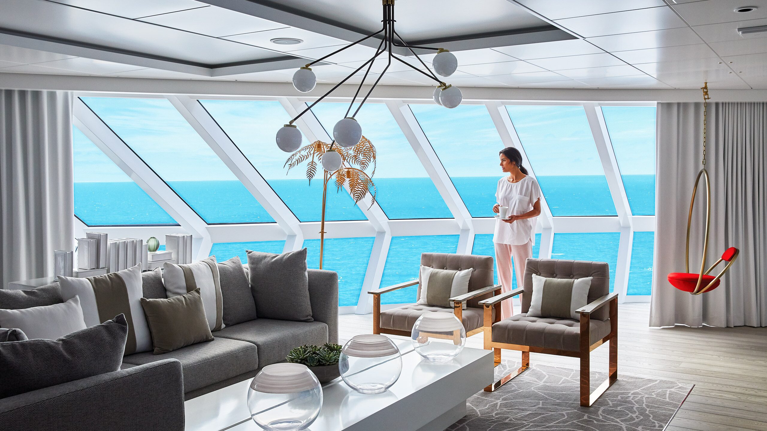 https://www.celebritycruises.com/content/dam/celebrity/new-images/staterooms/the-retreat-tank/celebrity-guest-in-iconic-suite-2560x1440.jpg